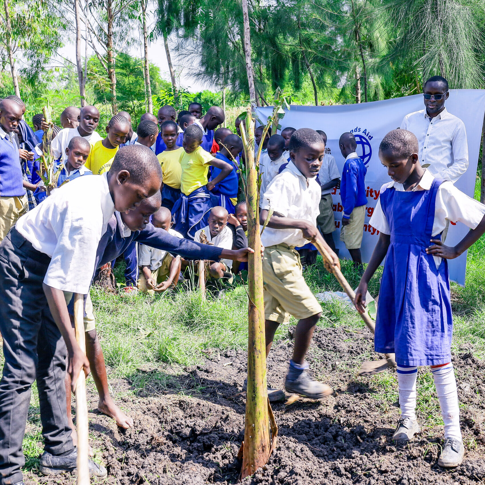 Children learning how to plant (1)