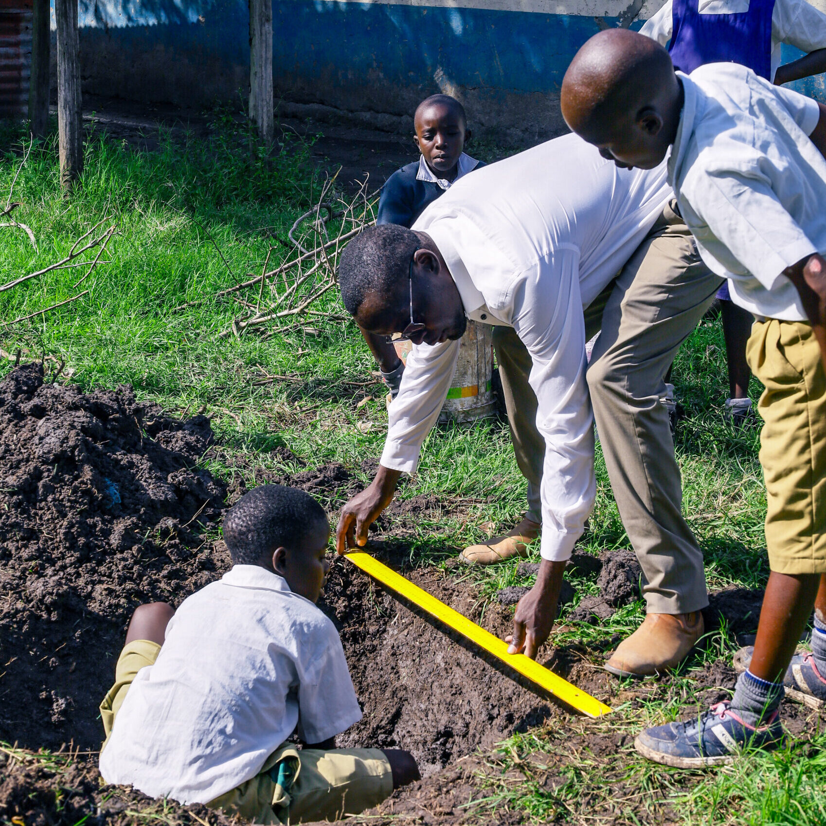 Children learning how to plant (2)